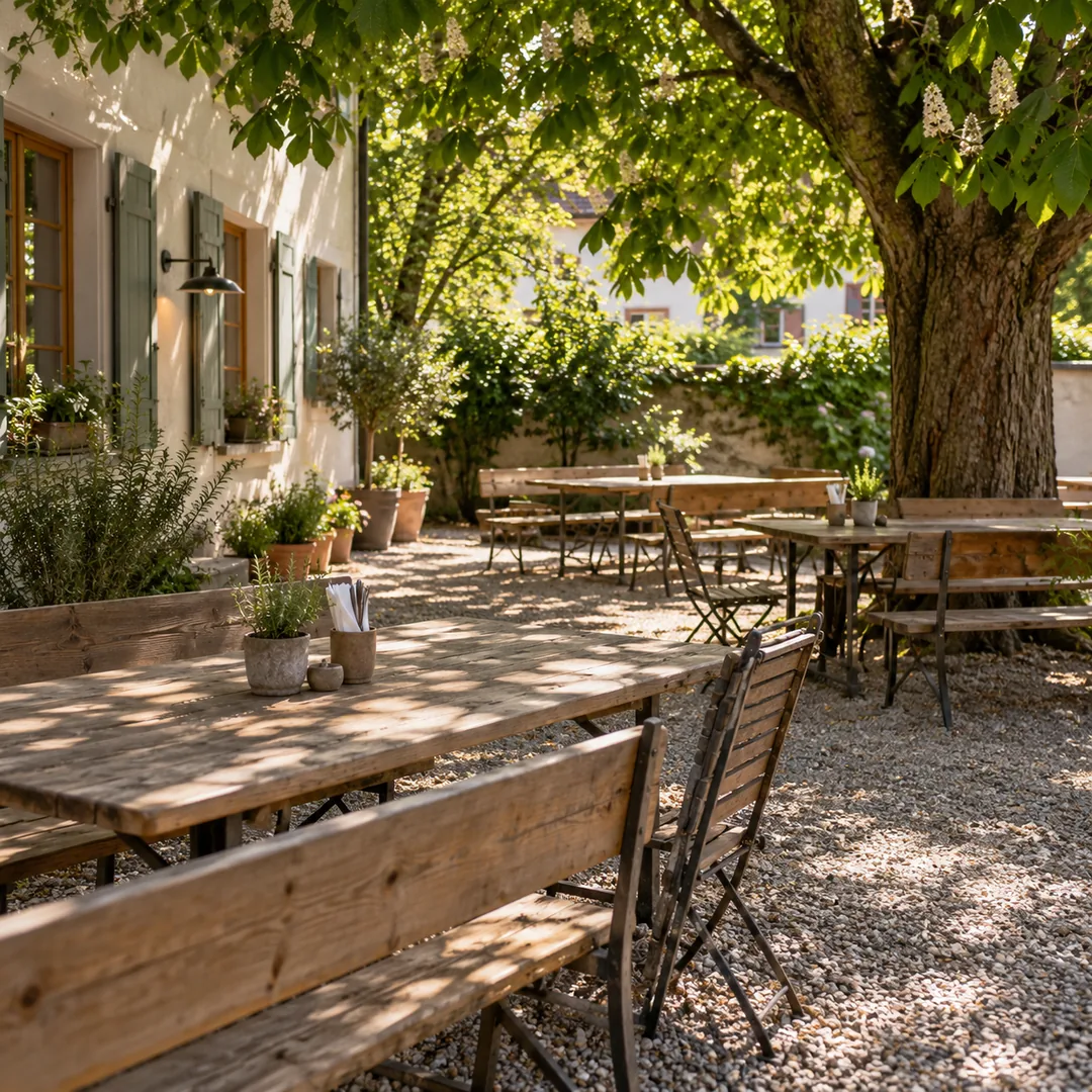 The garden with wooden tables under a chestnut tree
